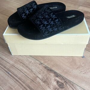 MK blacks slides/ slips on sandals
